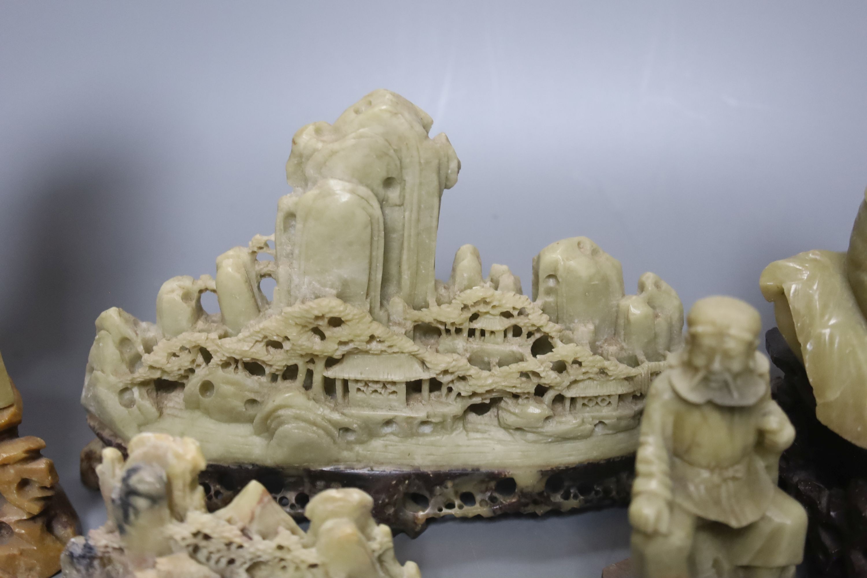 Seven Chinese soapstone carvings, 4 figurative carvings, largest 26 cms high including base.
